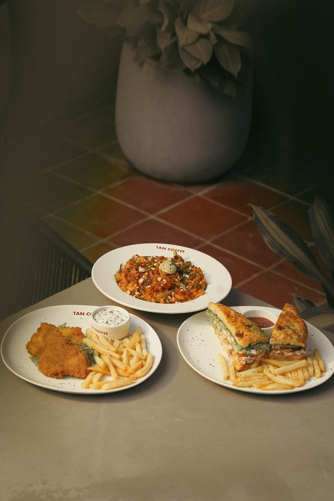 All-day breakfast plates with fries and a sandwich